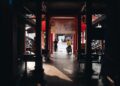Shadowy market passageway with people in Terengganu, Malaysia.