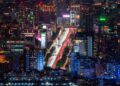 A breathtaking aerial view of Taipei at night showcasing bustling streets and illuminated skyscrapers.