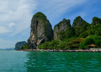 Discover the breathtaking beauty of Krabi, Thailand with iconic limestone cliffs, turquoise waters, and lush greenery.
